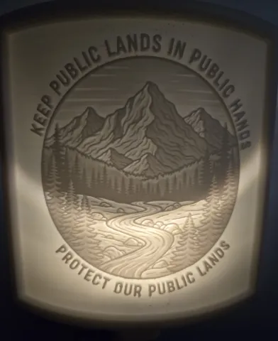 A nightlight lithophane displaying the text "Keep Our Public Lands Public"