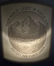 A nightlight lithophane displaying the text "Keep Our Public Lands Public"